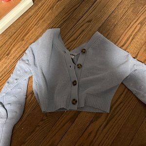 Light blue sweater with buttons never worn but tag is taken off